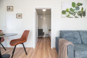 a living room with a couch and a table at Ubytovanie Pod Farou Bojnice in Bojnice