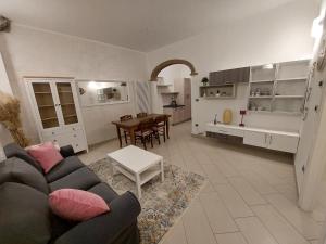 a living room with a couch and a table at Agriturismo La Fine in Piancaldoli