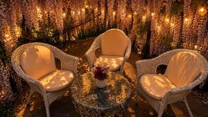 a group of chairs and a table and lights at Gan Eden B&B in Monterenzio +81 photos