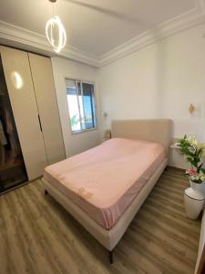 a bedroom with a large bed in a room at Green Oasis in Bou Ficha +47 photos