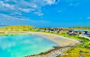 an aerial view of a beach with a group of houses at Holiday Suite in Bugøynes