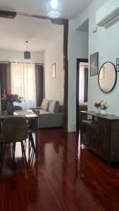 a living room with a couch and a table at Un Rincón en Alcalá in Alcalá de Henares +13 photos