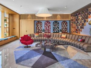 a large living room with a couch and a table at Mercure Xi'an Daming Palace in Xi'an