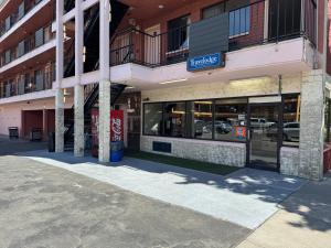 an empty parking lot in front of a building at Howard Johnson by Wyndham Downtown Reno in Reno