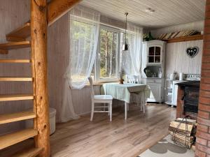 a dining room with a table and a window at My little happy place in Undva