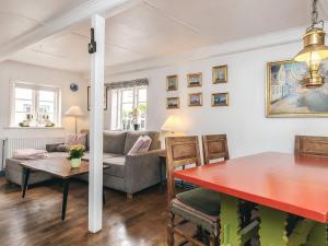 a living room with a table and a couch at 4 person holiday home in Ærøskøbing-By Traum in Ærøskøbing
