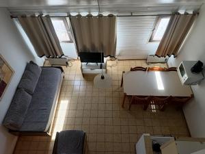 an overhead view of a living room with a table and chairs at Apart Las Lenas in Las Lenas