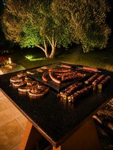 a table with a bunch of food on it at Luxury home private duras in Duras