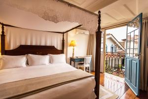 Cama ou camas em um quarto em Hotel Solar do Rosário