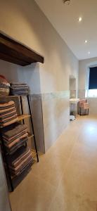 a room with a pile of towels on a shelf at Chateau de Gendersberg in Hanviller