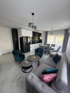 a living room with a couch and a table at Apartment Lumos in Ljubuški
