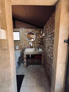 a bathroom with a sink and a mirror at Orpheus Camping in Kaneb Pos +98 photos