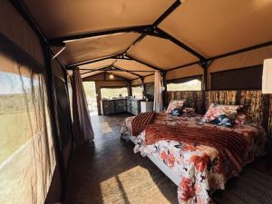 a bedroom in a tent with a bed in it at Orpheus Camping in Kaneb Pos