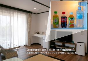 a shelf with soda bottles on it in a living room at Hananoyado Yumefuji in Fujikawaguchiko