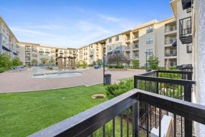 a balcony view of a apartment complex with a courtyard at Relaxing Getaway with Pool view & Gym in Frisco