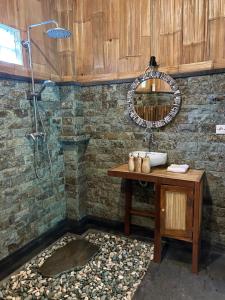 a bathroom with a sink and a shower at Chez Lepusa in Sidemen +93 photos