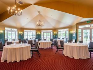 a large room with tables and chairs in it at Wairakei Resort Taupo in Taupo