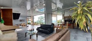 a living room with a couch and a table at Espectacular Quinta privada in Viotá