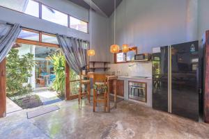 a kitchen with a counter and a table in a room at Union House with generator in Dapa
