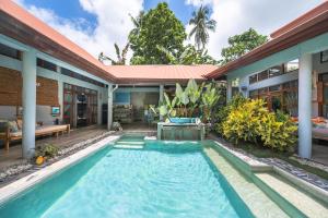 a swimming pool in the backyard of a house at Union House with generator in Dapa