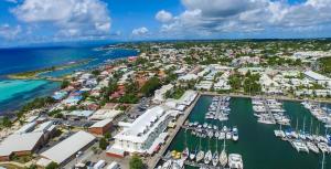 an aerial view of a harbor with boats in the water at Studio Atoumo Marine 5 in Saint-François