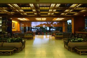 a lobby of a hotel with chairs and tables at Kagoshima Sunamushionsen Ibusuki Hakusuikan in Ibusuki