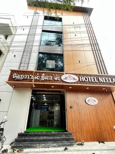 a hotel with a staircase leading into a building at S Hotel Neela in Musiri +15 photos