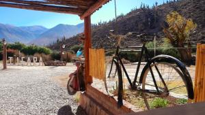 a bike parked on the side of a building at Al Pie del Pucara in Tilcara