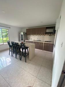 a kitchen with a table and chairs in a room at Dream Country Cabin in Cañaveral