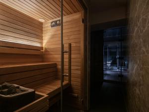a sauna with a glass door in a room at Lomä Central Peaks in Shinano +32 photos