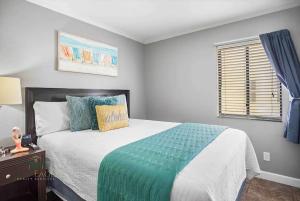 a bedroom with a large bed and a window at Bayfront 2BR2BA Condo at Sailport Minutes from Beaches & Downtown Attractions in Tampa