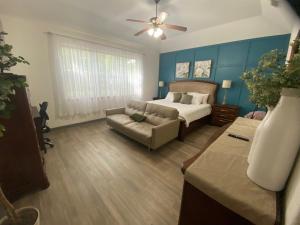 a living room with a bed and a couch at Delaware Springs Home in Burnet