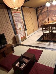 a room with a table and a box on the floor at 旅籠小龍 in Kochi +13 photos