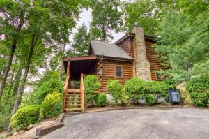 a log cabin in the woods with a driveway at Afternoon Delight 1 Bedroom Cabin Rental between Gatlinburg and Pigeon Forge Great Couple getaway in Sevierville