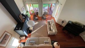 an overhead view of a living room with couches and a piano at Branca Countryside Retreat in Coruche