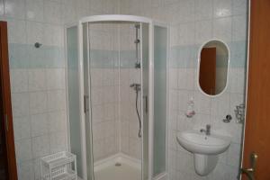 a bathroom with a shower and a sink at Penzión Koruna in Nitrianske Rudno +44 photos