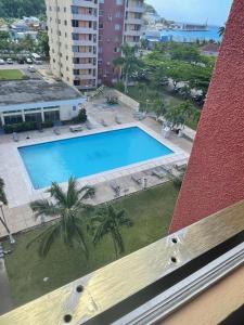 a view of a swimming pool from a building at Towers by the Beach in Ocho Rios