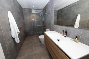 a bathroom with a sink and a toilet at Carruthers Chalet in Perisher Valley +17 photos