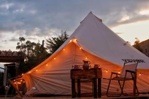 a large white tent with lights on it at Chantli Nawi Glamping & Temazcal in Ixtafiayuca +21 photos