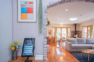 a living room with a couch and a table at Star Peak Villa 黒川 in Minamioguni