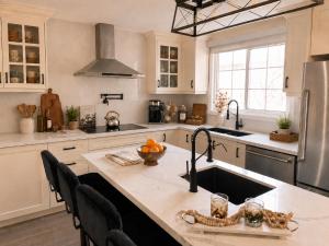 a kitchen with a sink and a counter top at Lux 5BR Spacious Home Near Yonge St in Newmarket