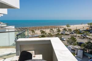 a view of the beach from the balcony of a building at Beach Bliss std in Infinity Pool & Spa Resort in Năvodari