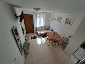 an aerial view of a living room with a table at Vacation home Dora in Baška +29 photos