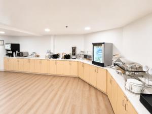 a large room with a kitchen with a counter top at Sleep Inn Staunton in Staunton