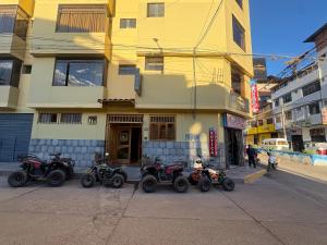 a group of four atvs parked in front of a building at Refugio del Valle del Sol in Urubamba