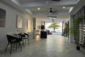 a dining room with a table and chairs in it at VS Beach Front in Jomtien Beach +83 photos