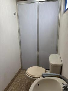 a bathroom with a toilet and a shower and a sink at Hotel Casa Don Marcos in Ixtafiayuca +21 photos