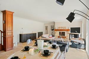 a living room with a table and a couch at Provencal Villa With Pool In Collobrières in Contre +32 photos