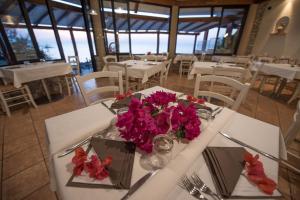 Restaurace v ubytování Baia del Godano Resort & Spa