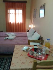 A bed or beds in a room at Zephyros